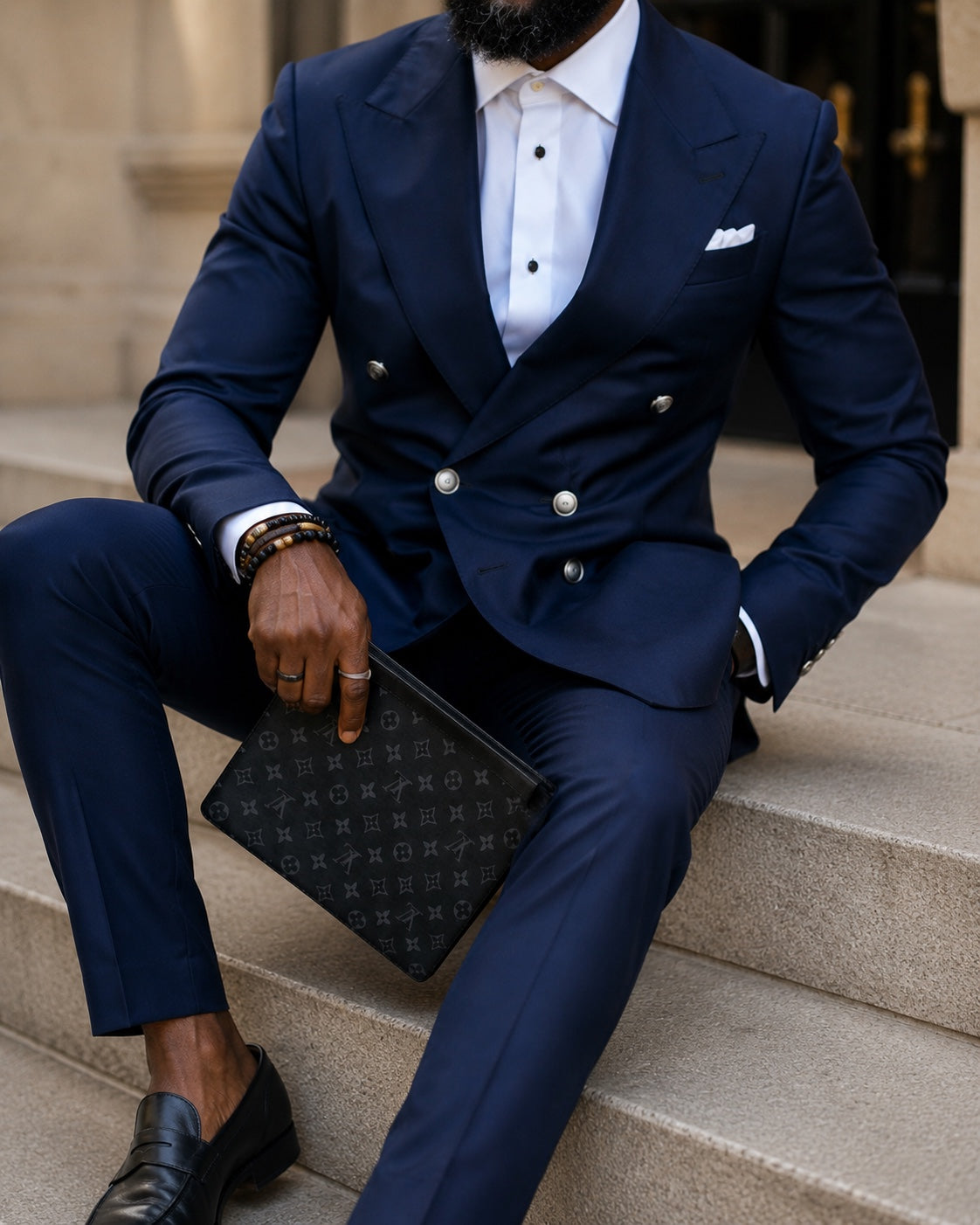 Details of a navy bespoke suit